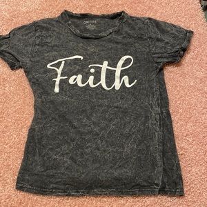 Grey shirt.says Faith in the front and Let your faith be bigger than your fears.
